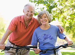 Photo of a man and woman on bicycles. Link to Life Stage Gift Planner Ages 60-70 Gifts.