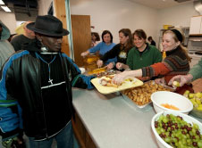 Photo of volunteers serving food